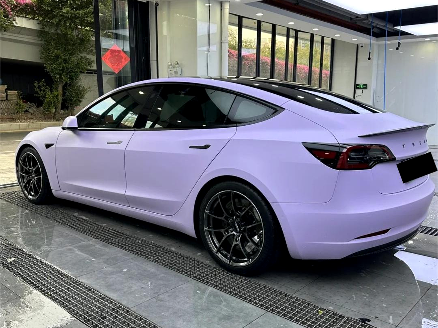 ArmorHue metallic purple color-change film on a premium EV